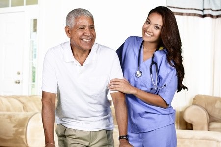 Nurse helping an elderly man