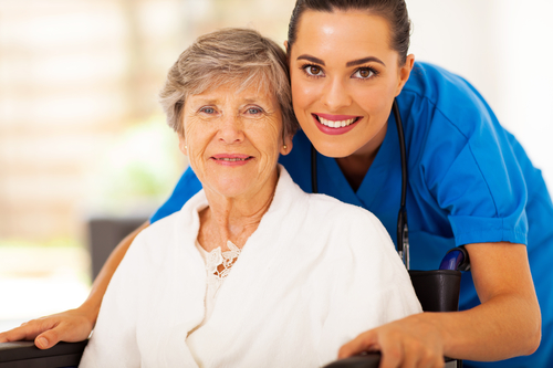 Senior Woman in Wheelchair with her In-Home Caregiver