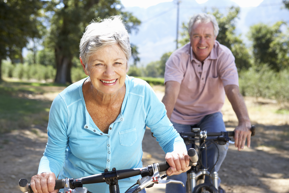 A senior couple riding their bikes - great exercise!
